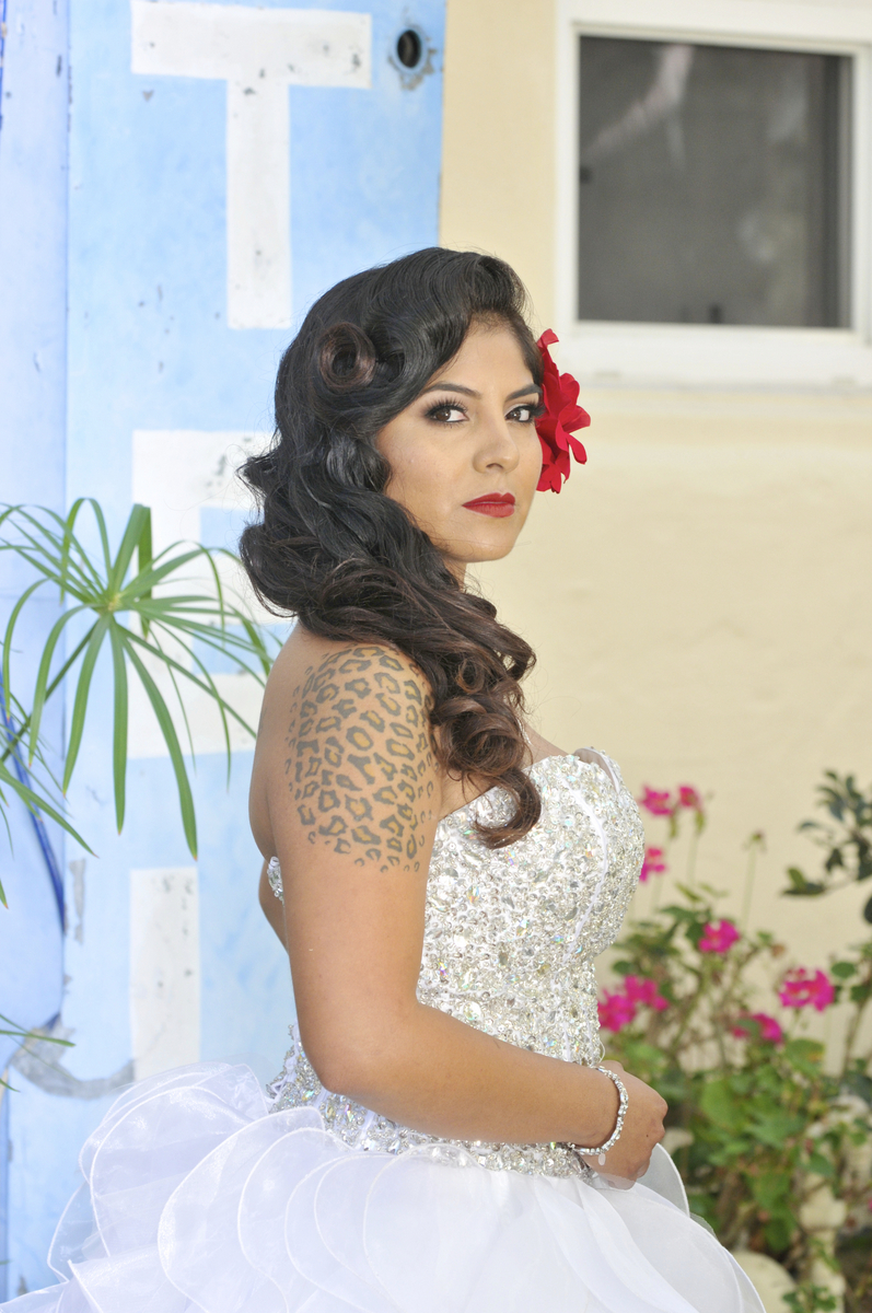 Bridal waves with a red flower, by Rico’s On 3rd